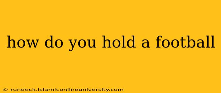 how do you hold a football