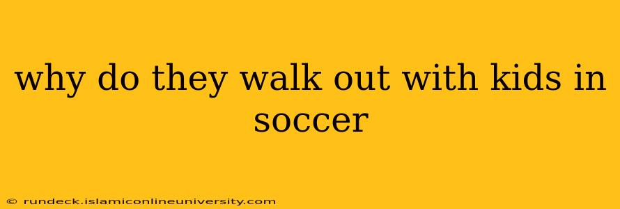 why do they walk out with kids in soccer